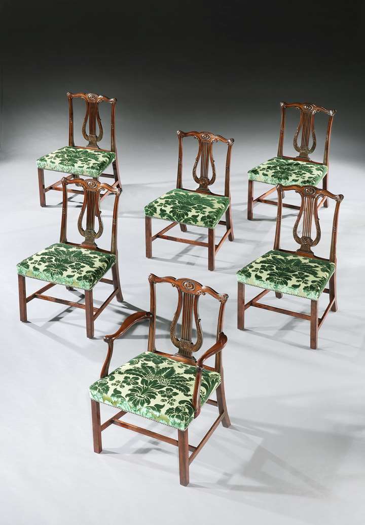 A SET OF TWELVE GEORGE III DINING CHAIRS ATTRIBUTED TO THOMAS CHIPPENDALE